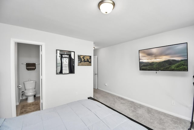 carpeted bedroom featuring ensuite bathroom