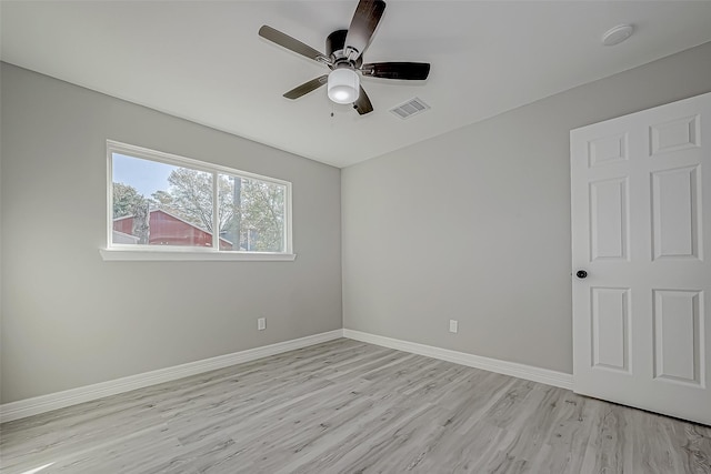 unfurnished room with ceiling fan and light wood-type flooring