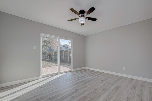 unfurnished room featuring ceiling fan and light wood-type flooring