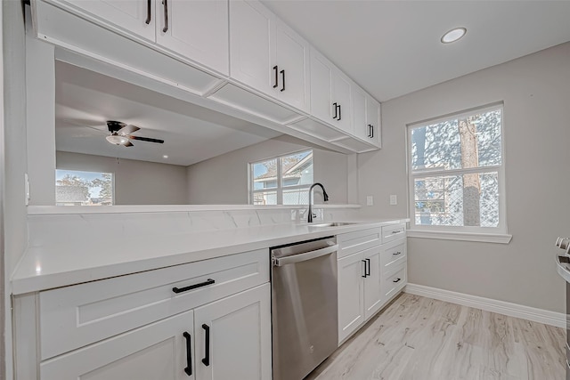 kitchen with white cabinets, dishwasher, a healthy amount of sunlight, and sink