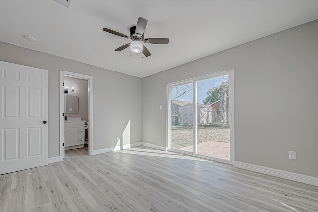 spare room featuring ceiling fan and light wood-type flooring