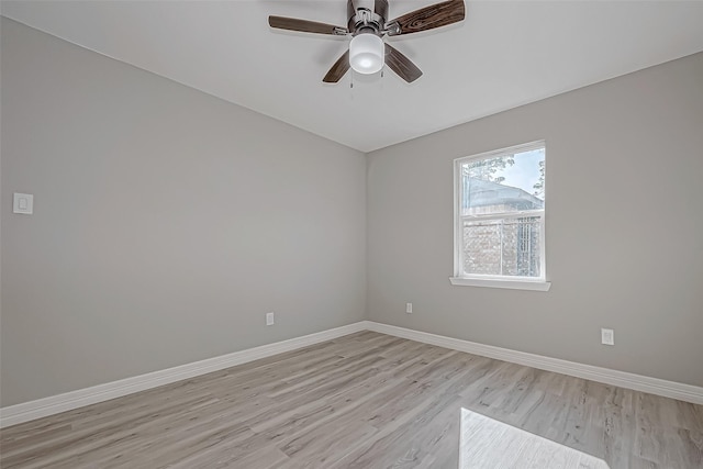 empty room featuring ceiling fan and light wood-type flooring