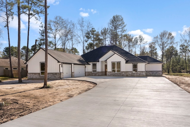 modern farmhouse featuring a garage