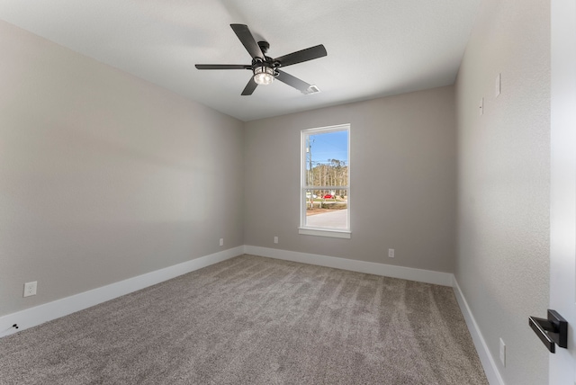 empty room featuring ceiling fan and carpet floors