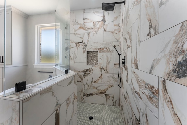 bathroom with tiled shower