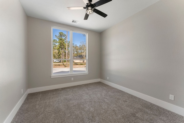 carpeted empty room with ceiling fan