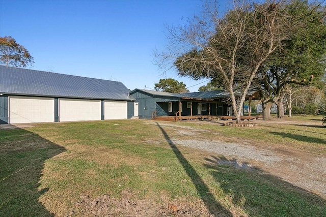 view of front of home with a garage and a front lawn