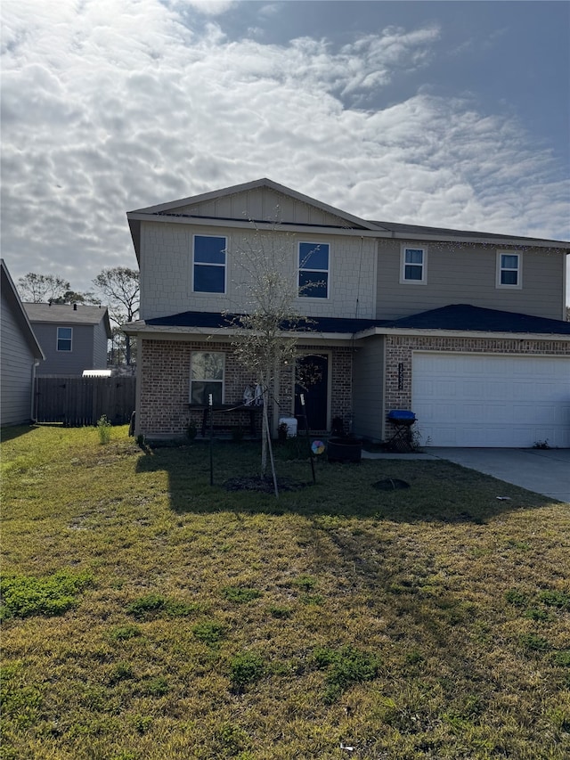 view of front property featuring a garage and a front lawn