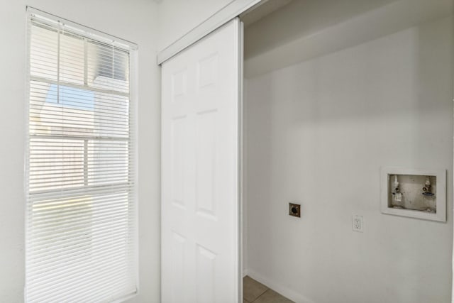 clothes washing area with tile patterned flooring, washer hookup, and electric dryer hookup