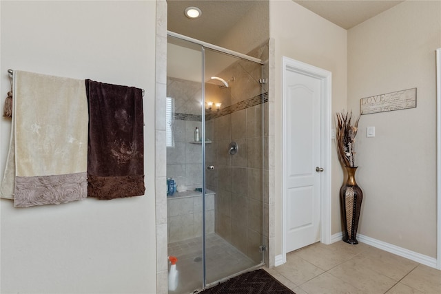 bathroom featuring tile patterned flooring and walk in shower