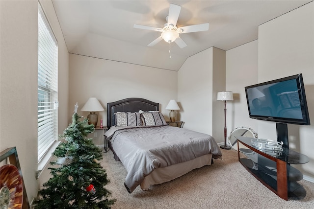 carpeted bedroom with ceiling fan and lofted ceiling