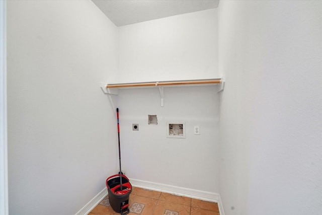 laundry area featuring electric dryer hookup, light tile patterned floors, and washer hookup