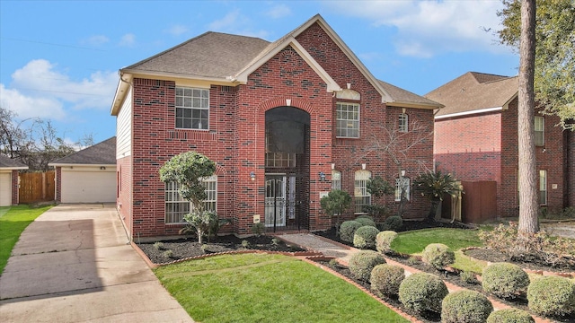 view of front facade with a front yard and a garage