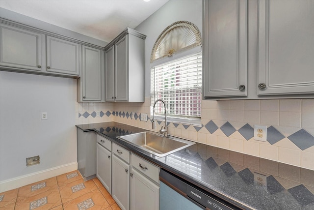 kitchen with dishwasher, sink, decorative backsplash, gray cabinets, and light tile patterned flooring