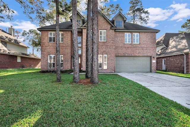 view of front of house with a front yard and a garage