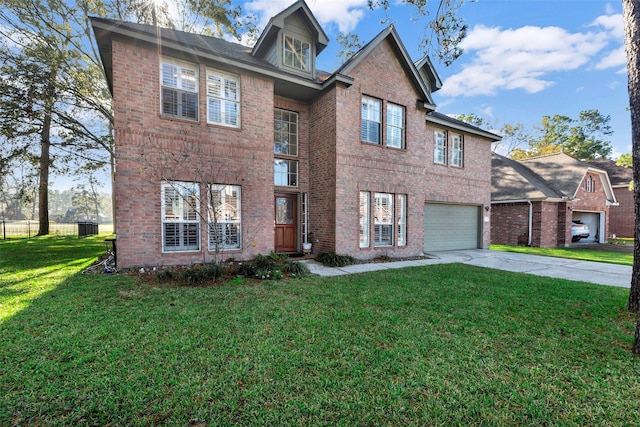 view of front of property featuring a garage and a front lawn