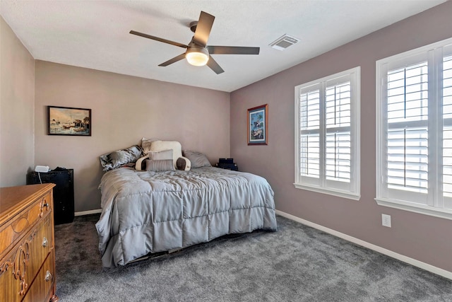 bedroom featuring dark colored carpet and ceiling fan