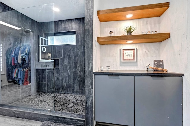 bathroom with tiled shower