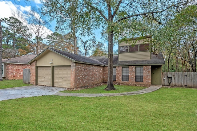 view of front of house with a garage and a front lawn