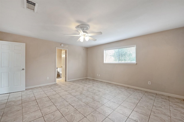 tiled empty room with ceiling fan