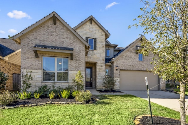 view of front of home featuring a front lawn and a garage