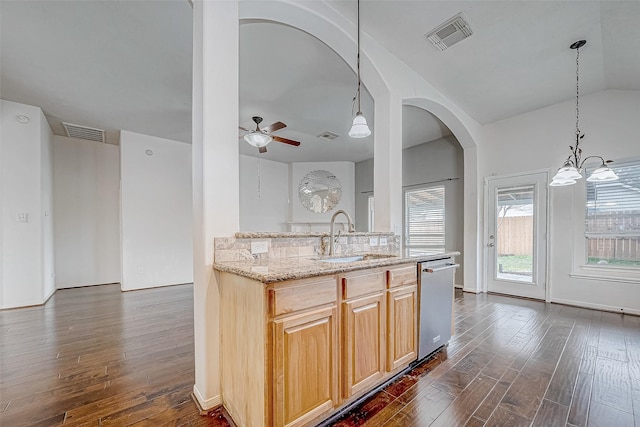 kitchen featuring dishwasher, ceiling fan with notable chandelier, sink, light brown cabinetry, and dark hardwood / wood-style flooring