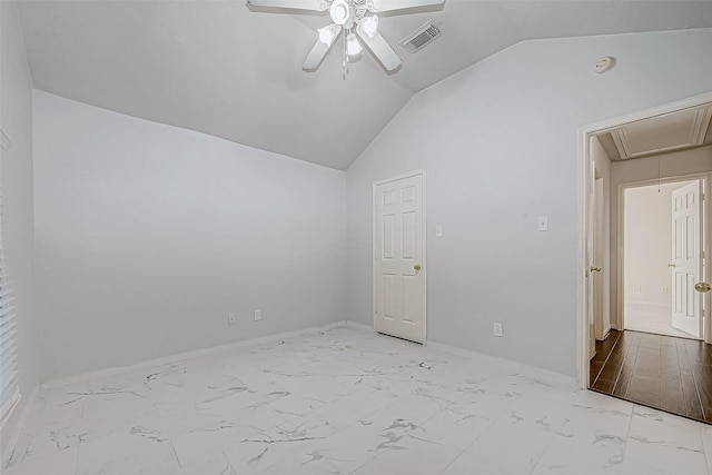 spare room featuring ceiling fan and lofted ceiling