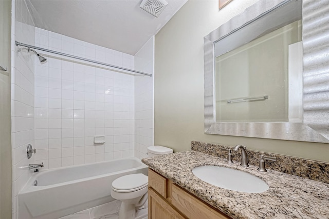 full bathroom featuring vanity, toilet, and tiled shower / bath