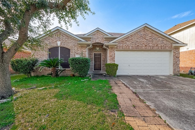 ranch-style house with a front yard and a garage