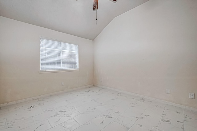 spare room with vaulted ceiling