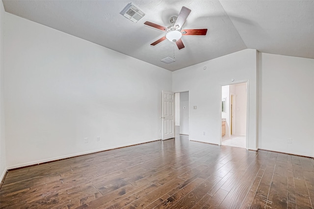 empty room with dark hardwood / wood-style flooring, ceiling fan, and lofted ceiling