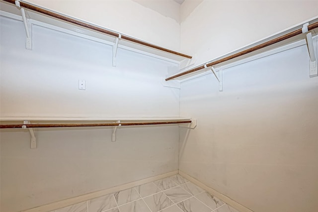 walk in closet featuring light tile patterned floors