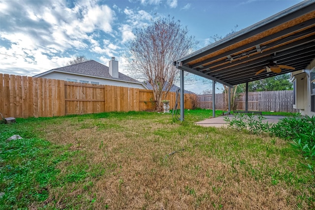 view of yard with ceiling fan