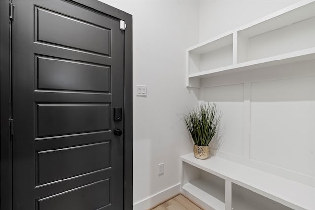 mudroom with light hardwood / wood-style floors