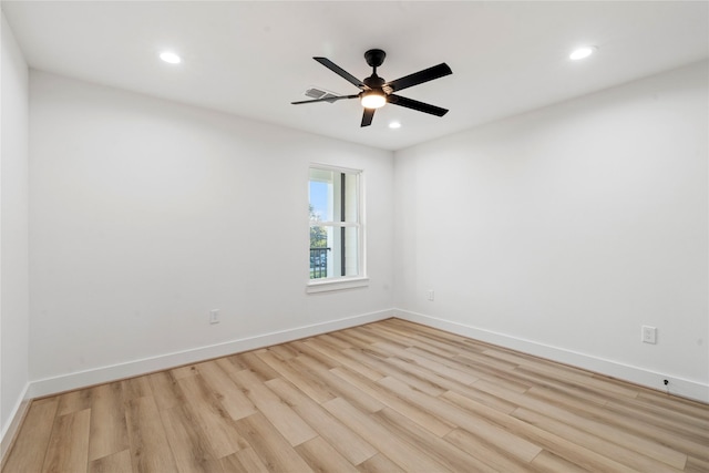 unfurnished room featuring ceiling fan and light hardwood / wood-style floors