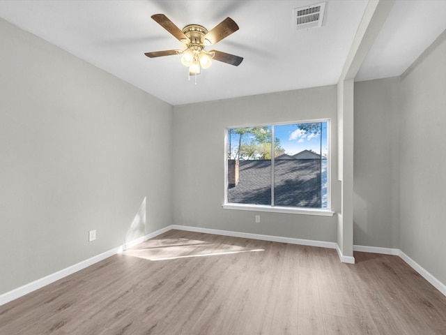 unfurnished room with ceiling fan and light wood-type flooring