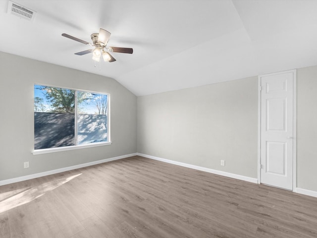 bonus room featuring hardwood / wood-style floors, ceiling fan, and lofted ceiling