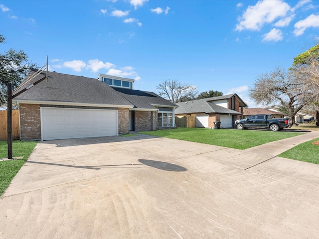 view of front of home featuring a garage and a front yard