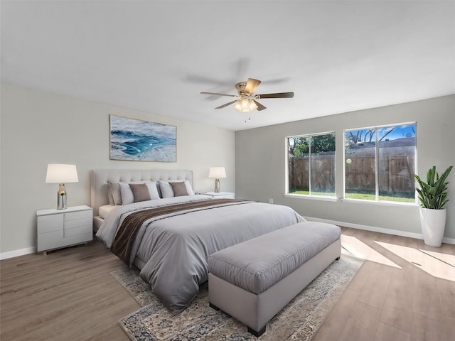 bedroom featuring ceiling fan and light hardwood / wood-style floors