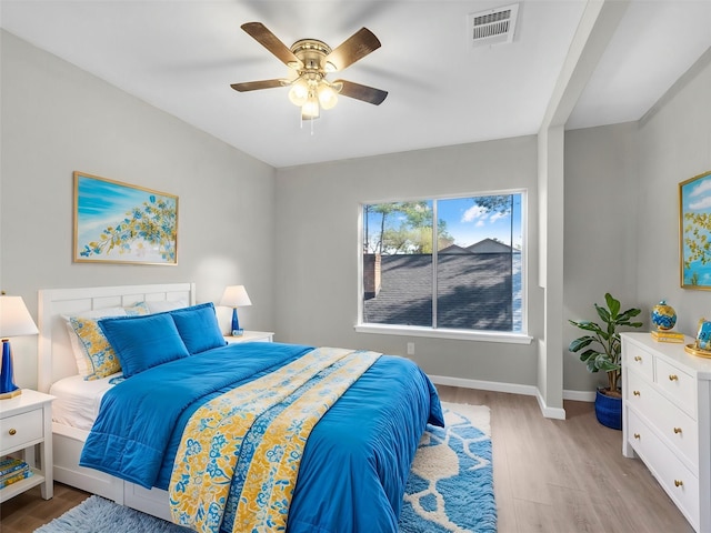 bedroom featuring ceiling fan and light hardwood / wood-style flooring