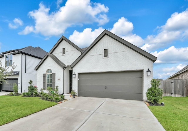 view of front facade featuring a garage and a front lawn