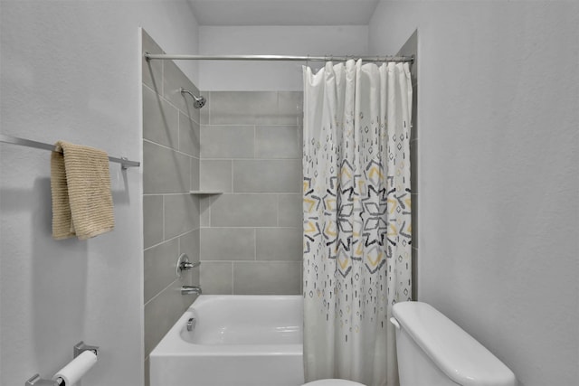 bathroom featuring shower / bath combo with shower curtain and toilet