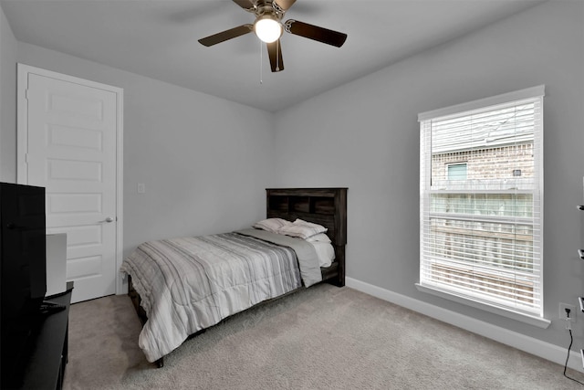 bedroom with light colored carpet and ceiling fan