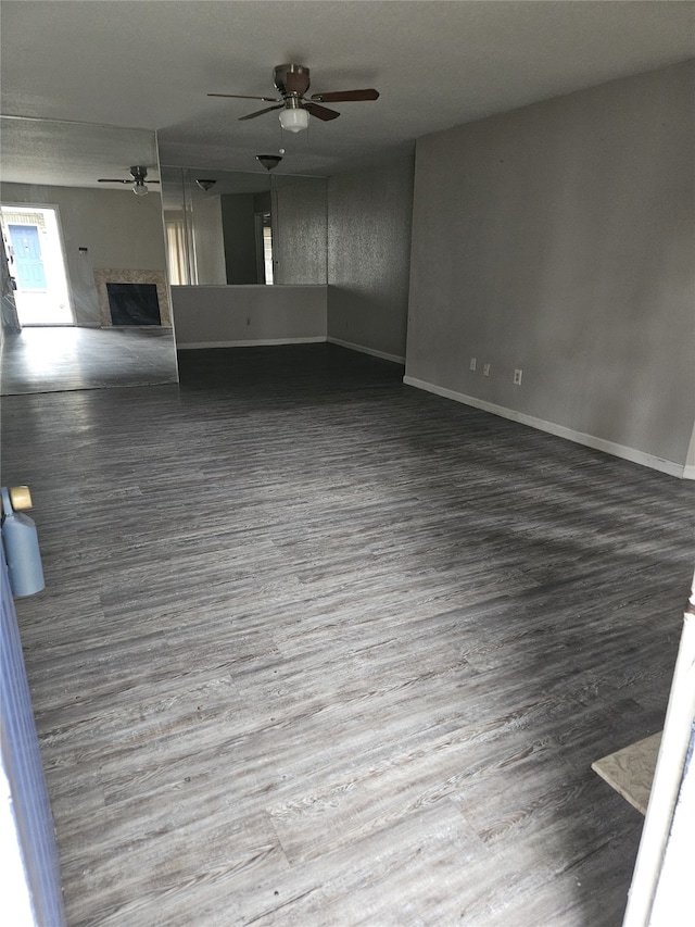 empty room featuring wood-type flooring and ceiling fan