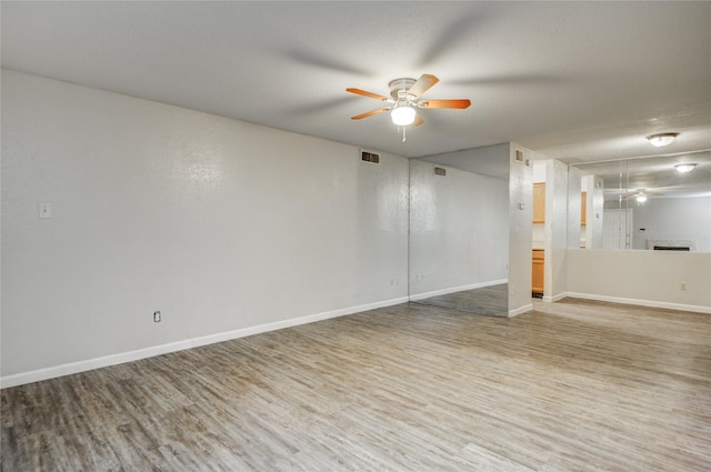 9797 Leawood Blvd Unit 903, Houston, TX 77099 - empty room with ceiling fan, wood finished floors, and baseboards