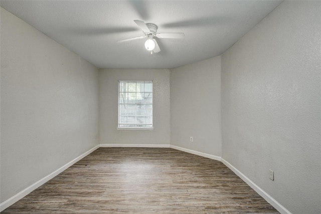 9797 Leawood Blvd Unit 903, Houston, TX 77099 - unfurnished room featuring wood finished floors, a ceiling fan, and baseboards