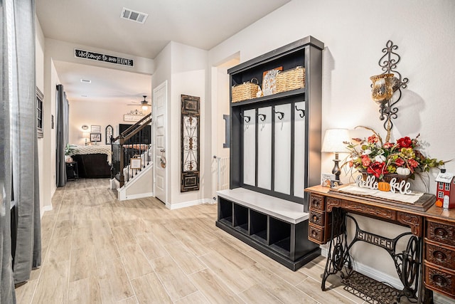 mudroom with ceiling fan and light wood-type flooring