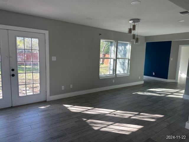 unfurnished room with dark wood-type flooring