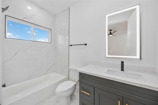 bathroom with marble finish floor, vanity, bathtub / shower combination, and toilet