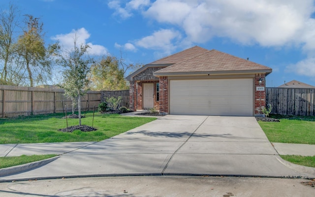 view of front of house featuring a garage and a front yard